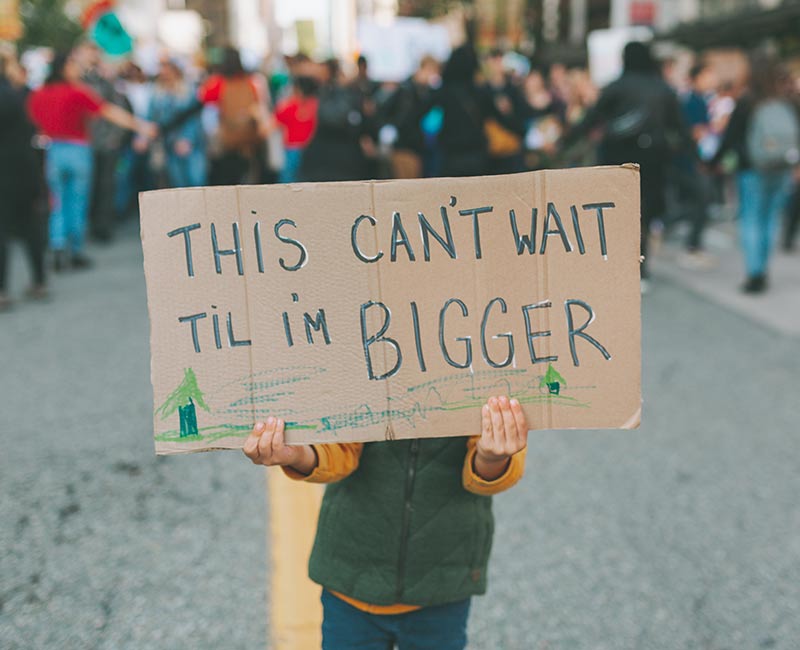 "This can't wait til I'm bigger" protest sign from child